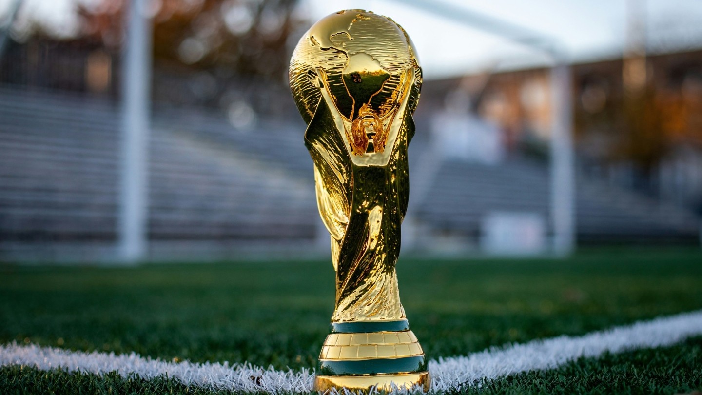 FIFA World Cup trophy on a football pitch