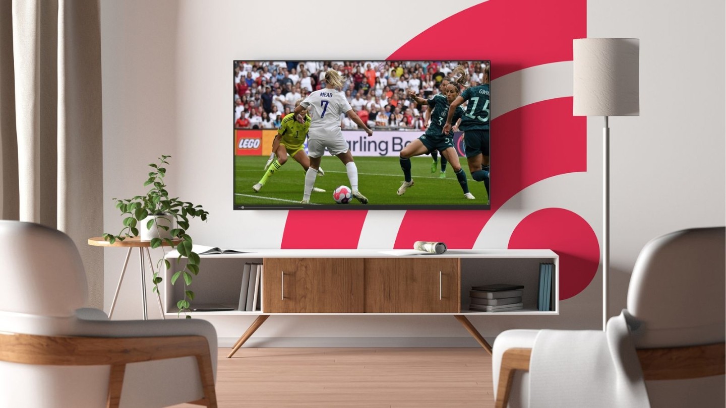 Image shows football match on Freely TV in a living room