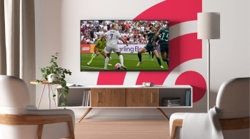 Image shows football match on Freely TV in a living room