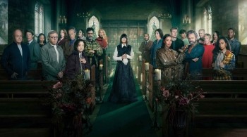 Cast of Celebrity Traitors standing inside a candlelit church during the BBC reality competition series.