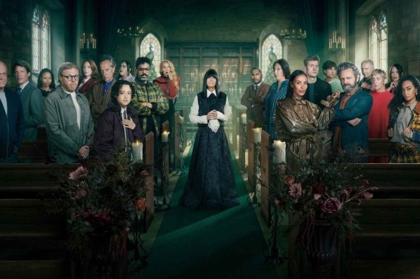 Cast of Celebrity Traitors standing inside a candlelit church during the BBC reality competition series.