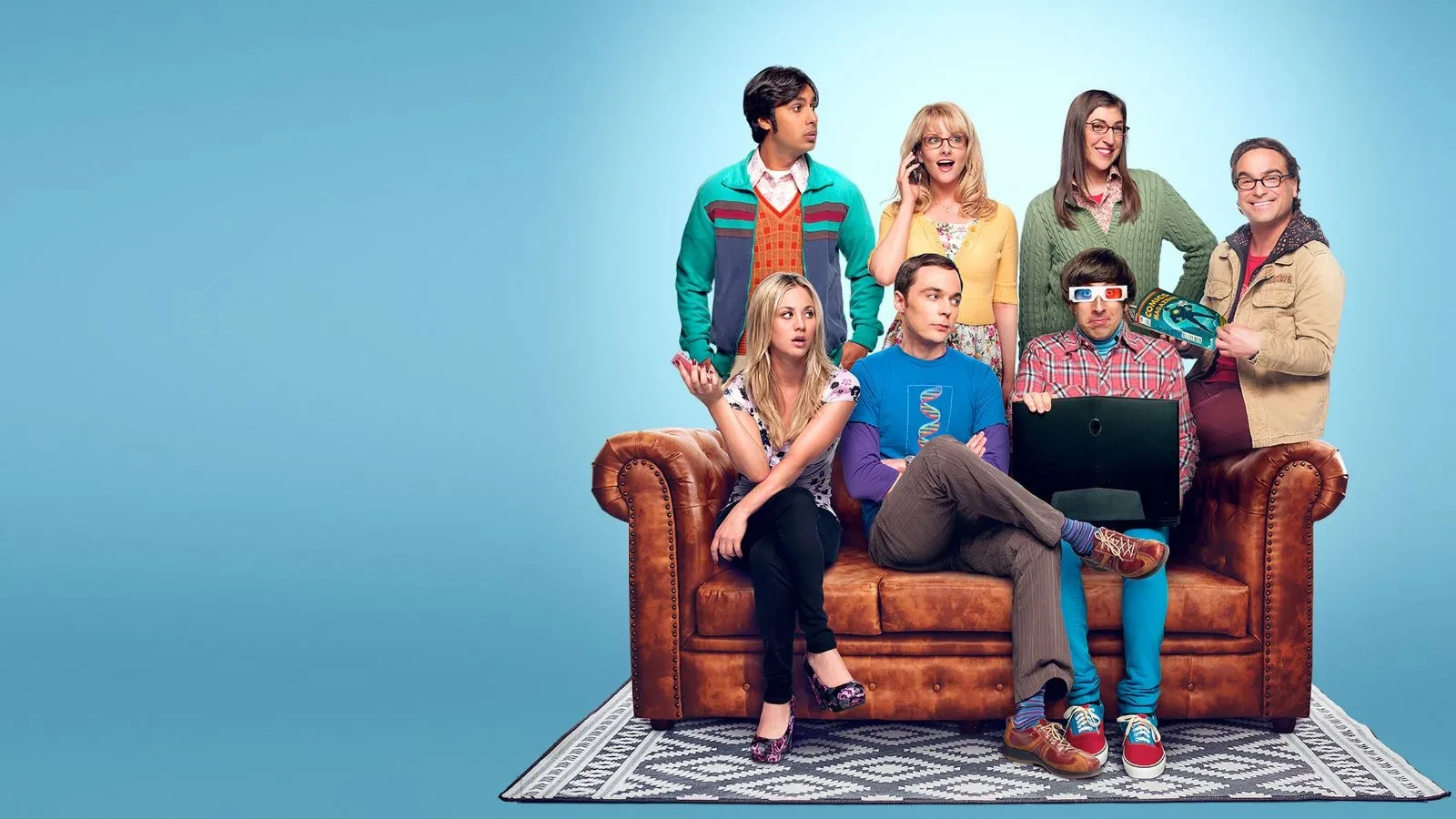  Promotional image for the sitcom The Big Bang Theory, featuring Jim Parsons as Sheldon Cooper, Johnny Galecki as Leonard Hofstadker, and Kaley Cuoco as Penny. The ensemble cast is shown gathered around a brown leather sofa, also including Simon Helberg, Kunal Nayyar, Melissa Rauch, and Mayim Bialik