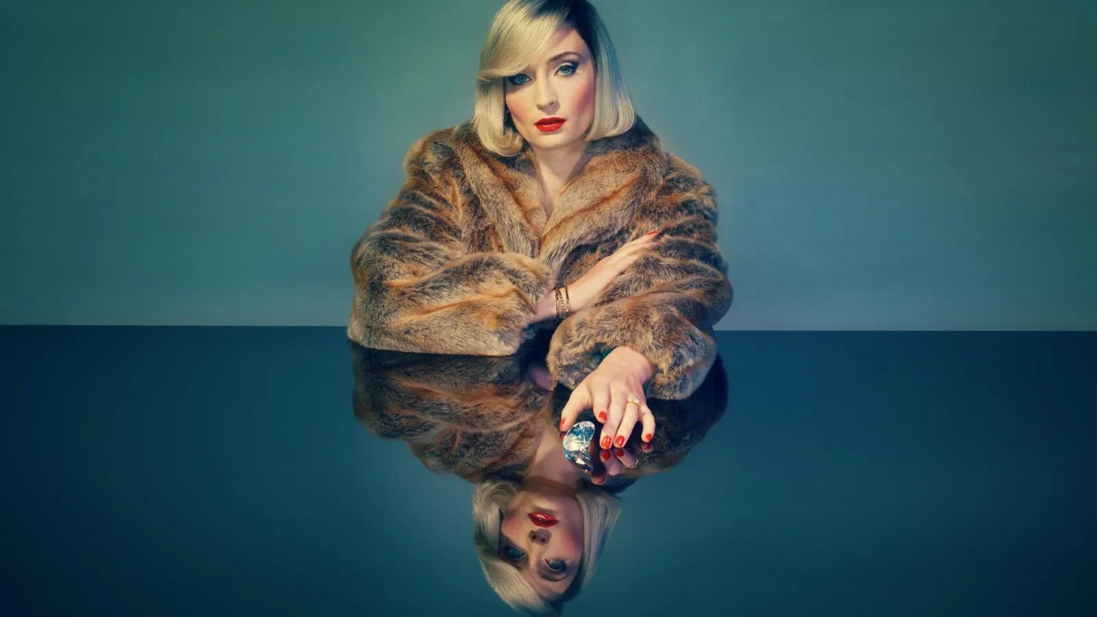 Promotional image for the TV series Joan. The image features Sophie Turner as Joan Hannington, a notorious real-life jewel thief in 1980s London