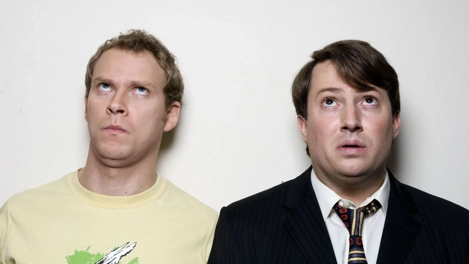 Promotional image for the TV series Peep Show. From left to right: Robert Webb as Jeremy "Jez" Usborne and David Mitchell as Mark Corrigan