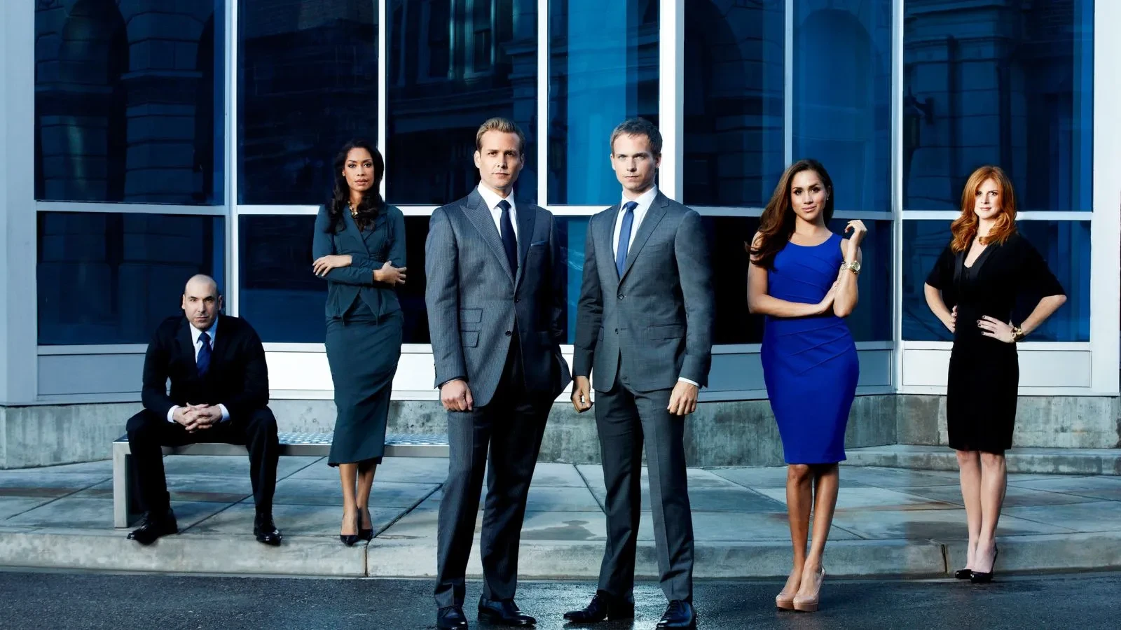 Promotional image for the TV series Suits. From left to right: Rick Hoffman as Louis Litt, Gina Torres as Jessica Pearson, Gabriel Macht as Harvey Specter, Patrick J. Adams as Mike Ross, Meghan Markle as Rachel Zane, and Sarah Rafferty as Donna Paulsen