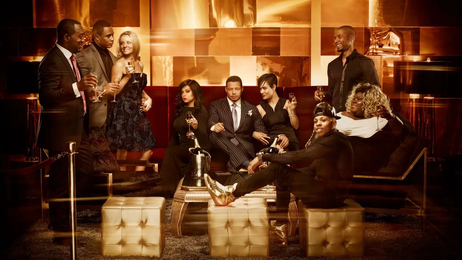 Promotional image for Empire Season 1 showing several cast members. The entire scene is bathed in a warm, golden glow with light streaks across the frame