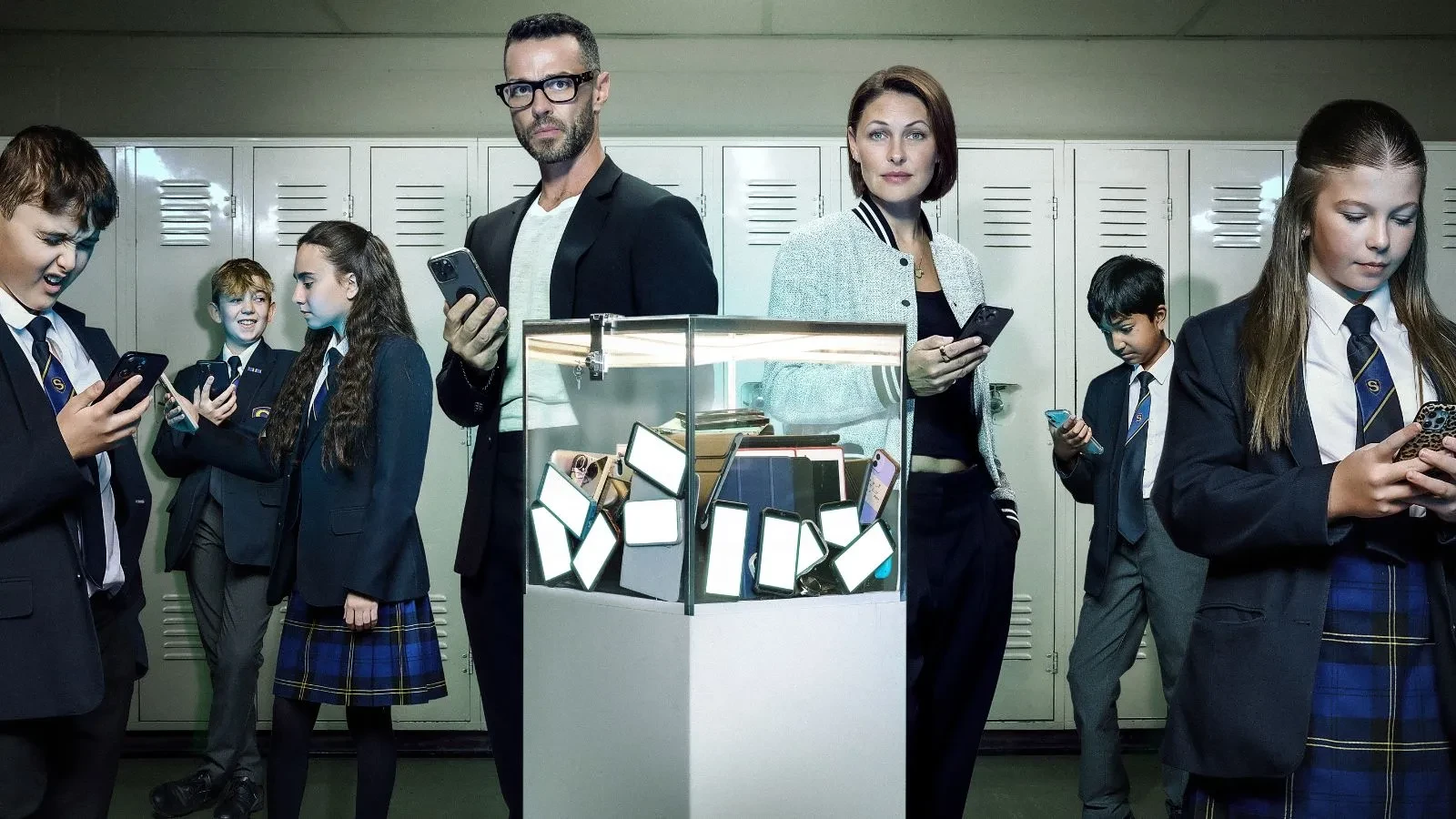 Promotional image for the Channel 4 documentary series Swiped: The School That Banned Smartphones. In the center, hosts Matt Willis and Emma Willis stand together