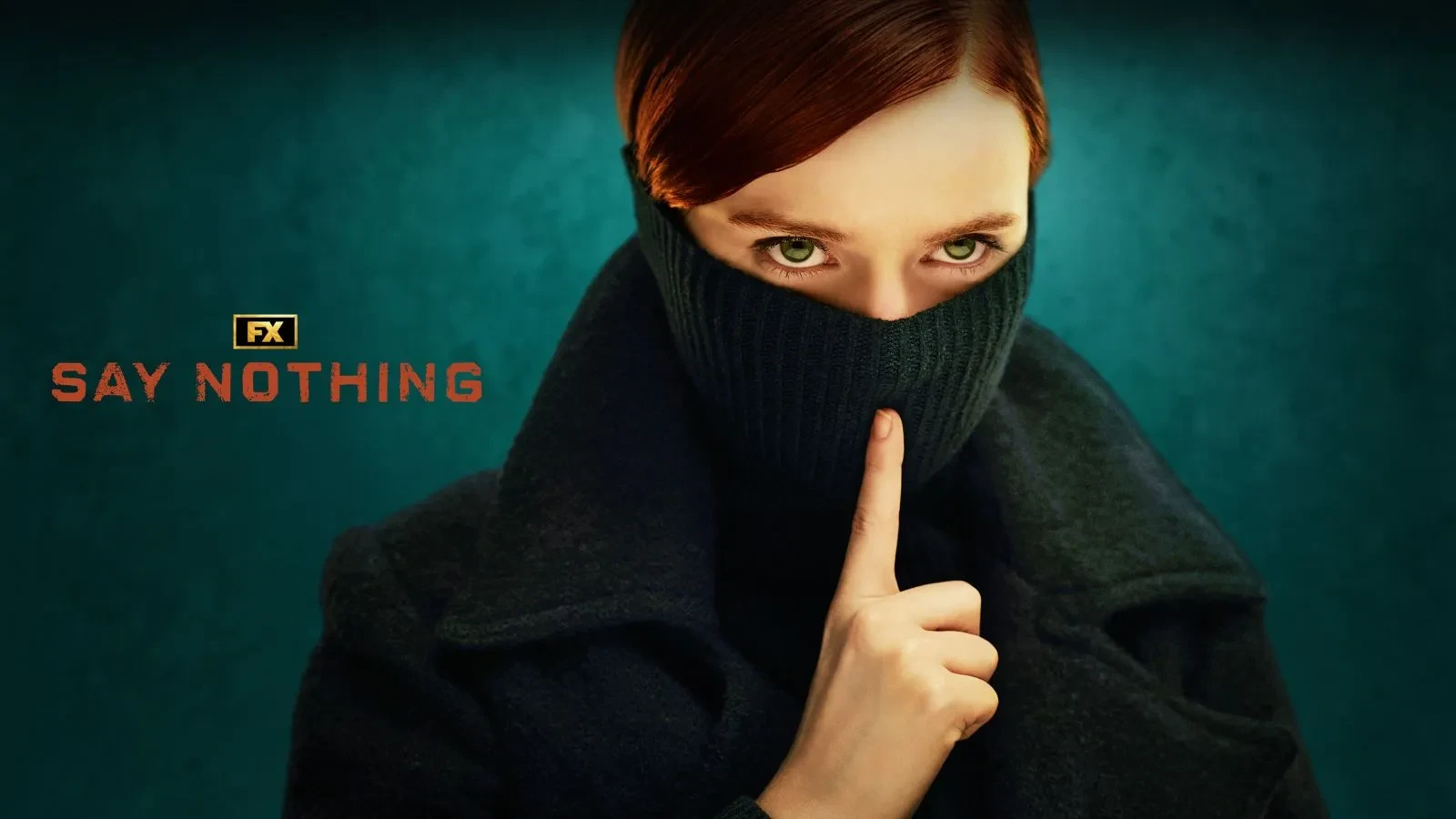 A women with aurburn hair and green eyes stood with half her face covered behind a scarf and her finger against where her lips would be, staring int the camera