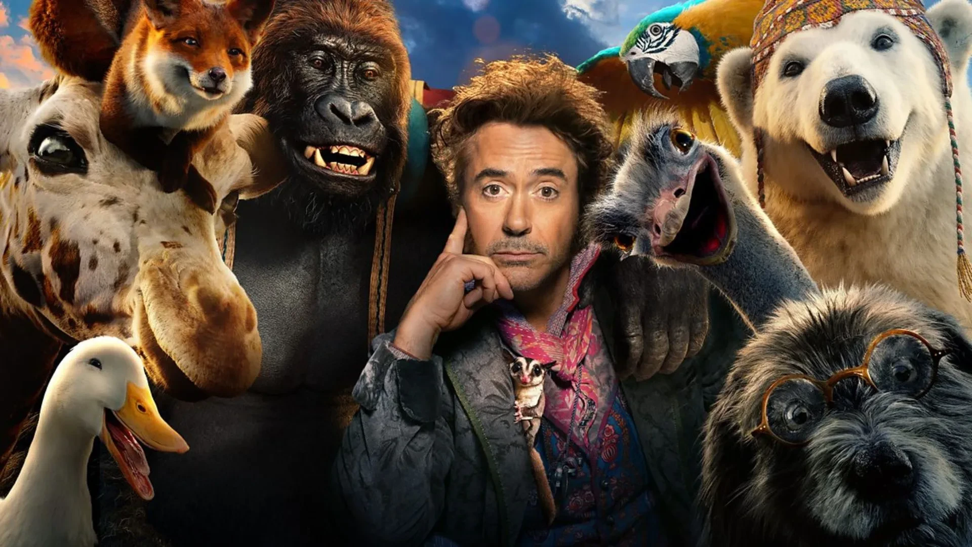 Promotional art for the film “Dolittle”, featuring a group of animals including a giraffe, duck, polar bear, parrot, ostrich, and a dog wearing glasses, gathered closely together in a colourful outdoor setting.