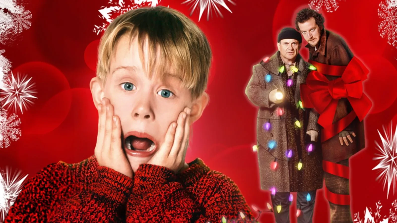 Festive red background with white snowflake patterns featuring a person in a red sweater in the foreground and two people wrapped in Christmas lights and a large red bow on the right side.