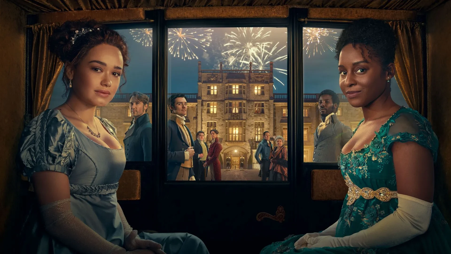 Two women in elegant Regency-era gowns sit inside a lavish carriage at night, with fireworks lighting up the sky above a grand manor in the background. The scene evokes celebration and historical drama, promoting the TV show Sanditon.