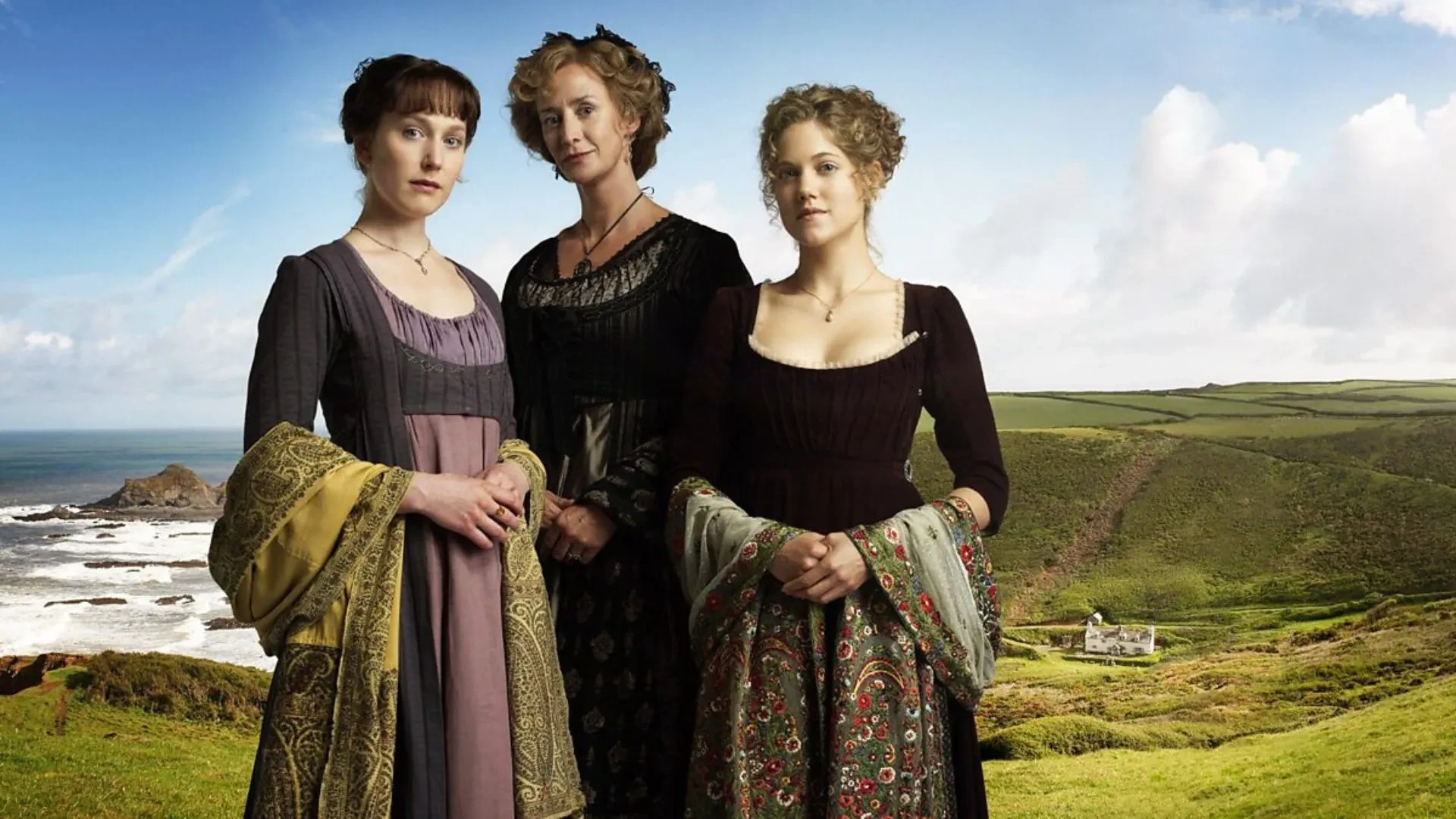 Today  wite short accessible alt text for this image - mention that it's a promotional image for the 2009 TV adaptation of Sense and Sensibility Three women in Regency-era dresses stand on a coastal hillside with waves and a cottage in the background; promotional image for the 2008 TV adaptation of Sense and Sensibility.
