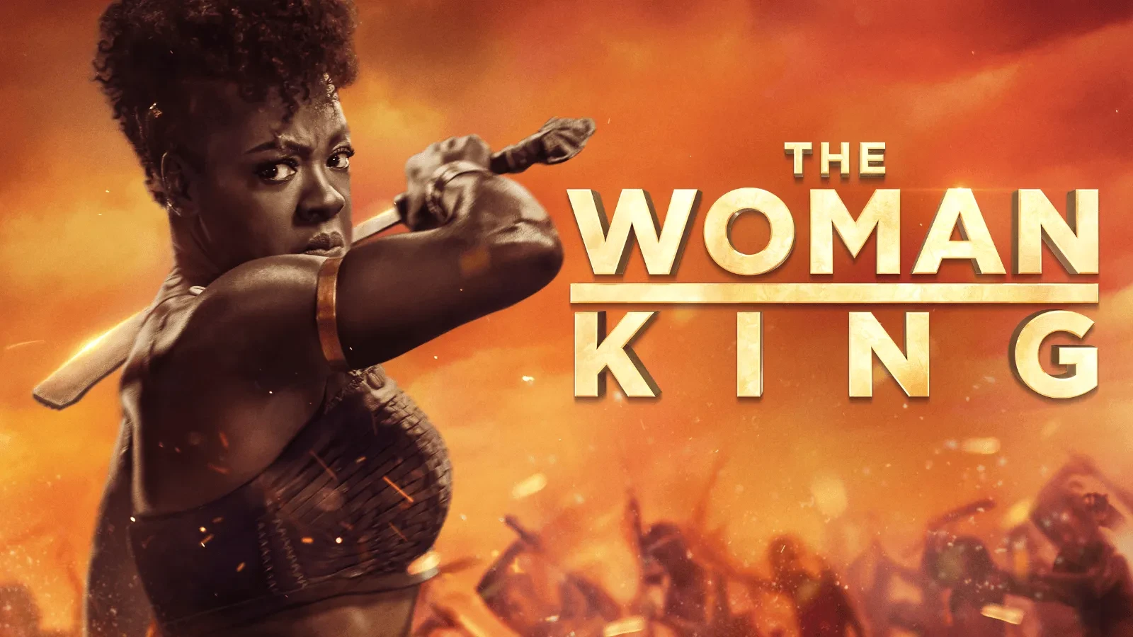 Promotional poster for the film The Woman King, showing a warrior holding a weapon against a dramatic orange battlefield backdrop.