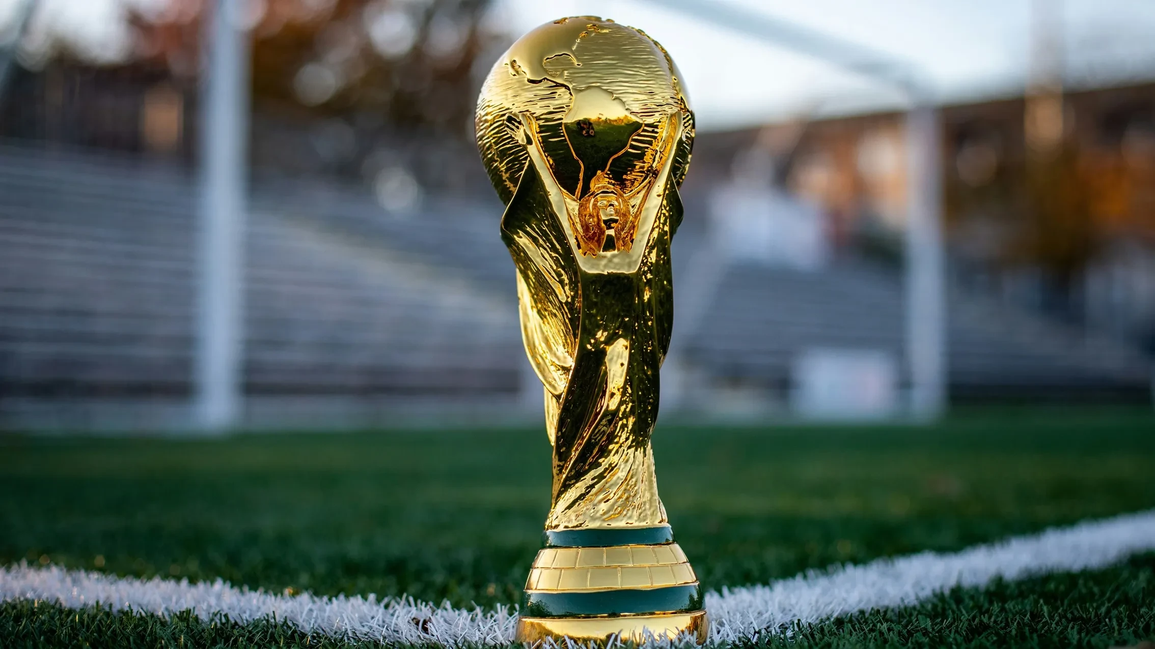 FIFA World Cup trophy on a football pitch
