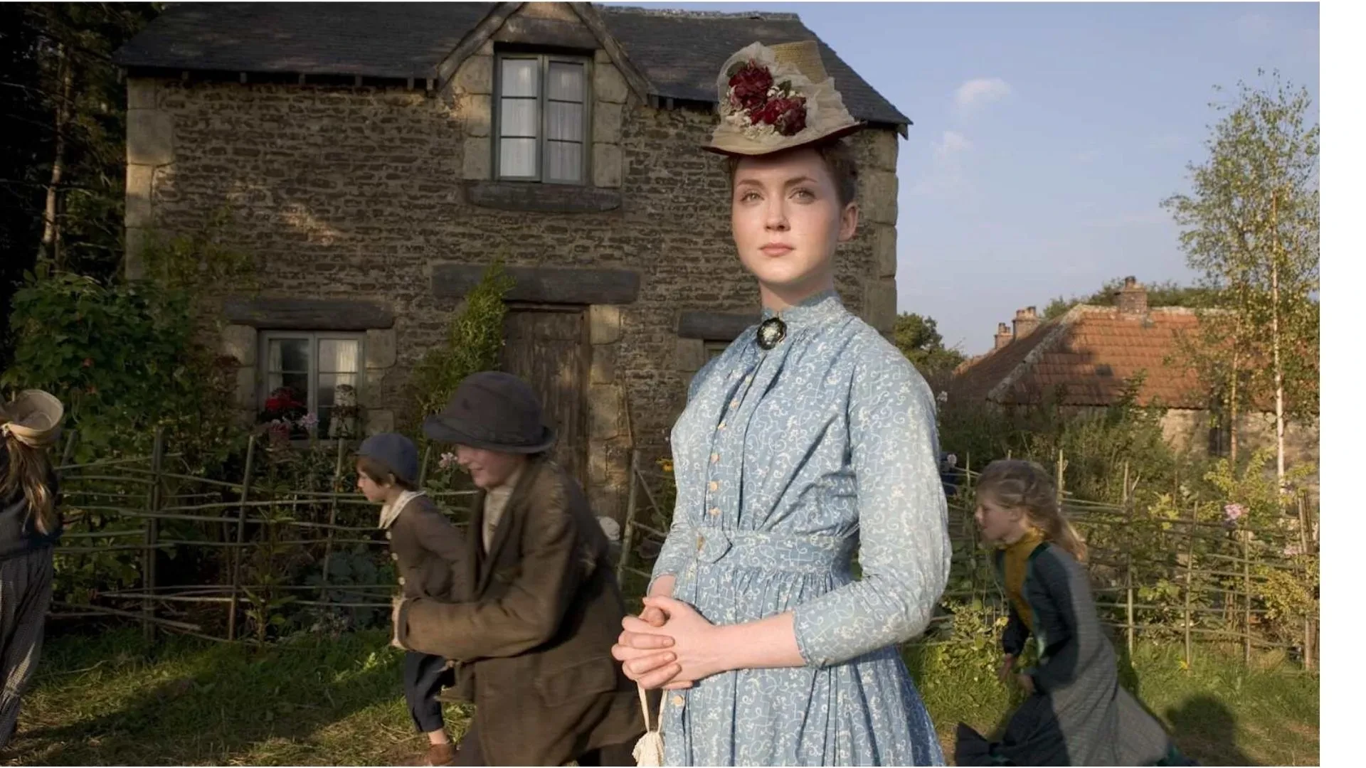 Rural Victorian village scene from Lark Rise to Candleford featuring period costumes and daily life in the English countryside.