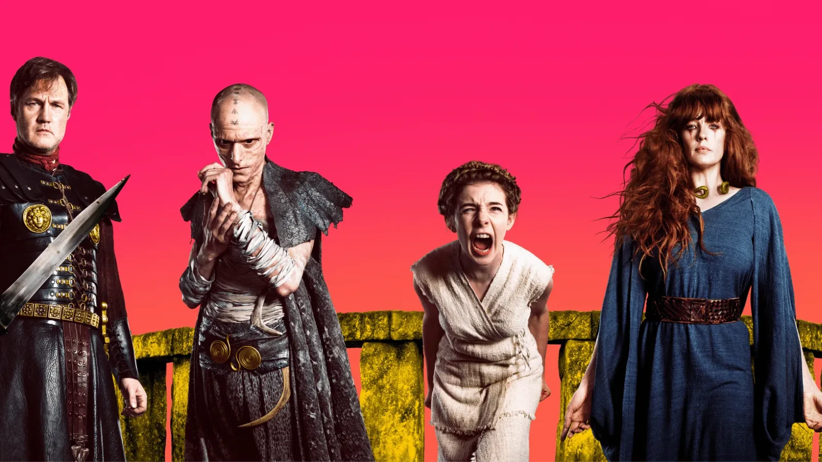 Three adults and a child in Roman age clothing against a pink background staring into the camera for the show Britannia