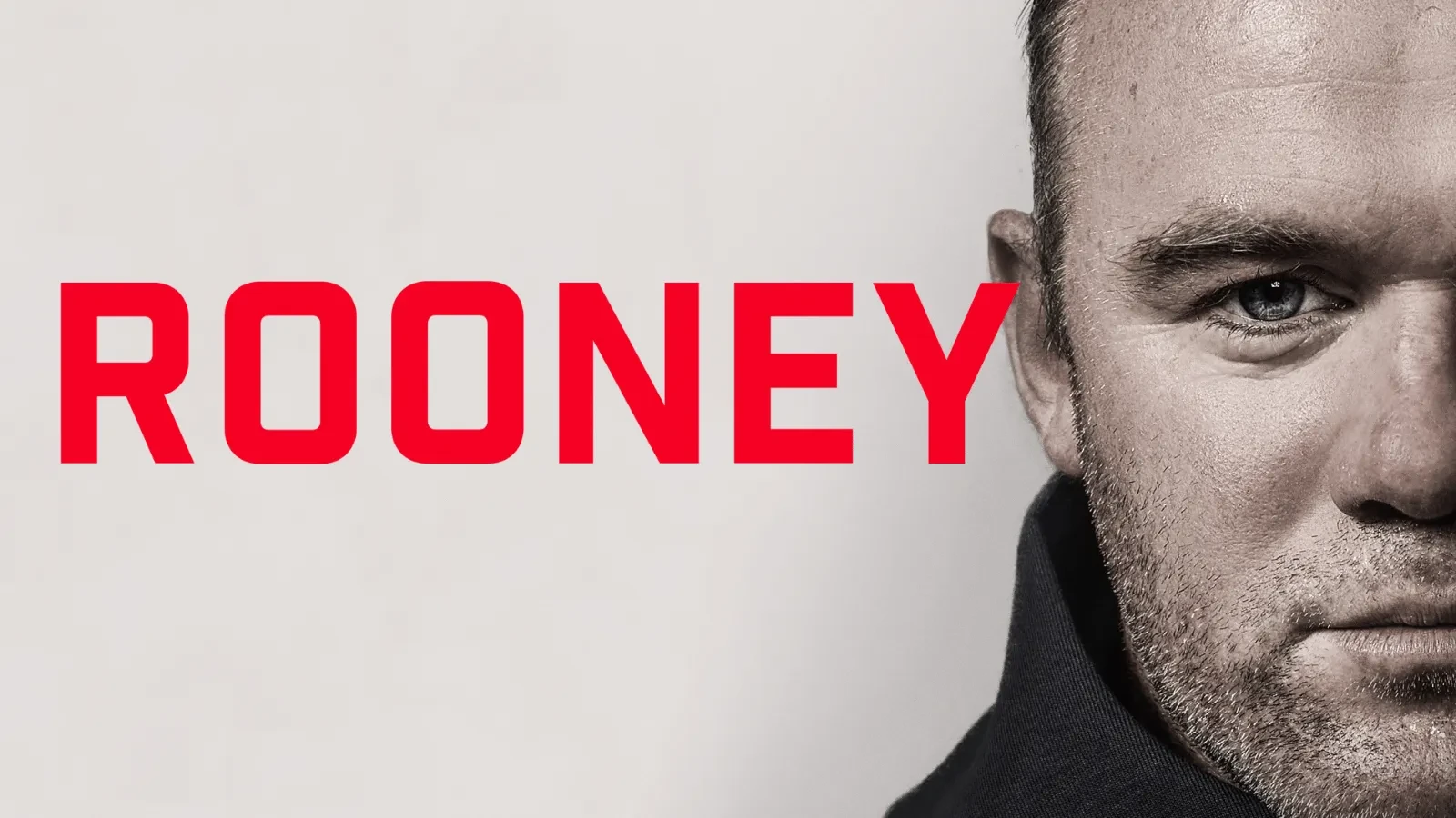 Half of Wayne Rooney's face staring into the camera with writing that reads "Rooney" in red next to him