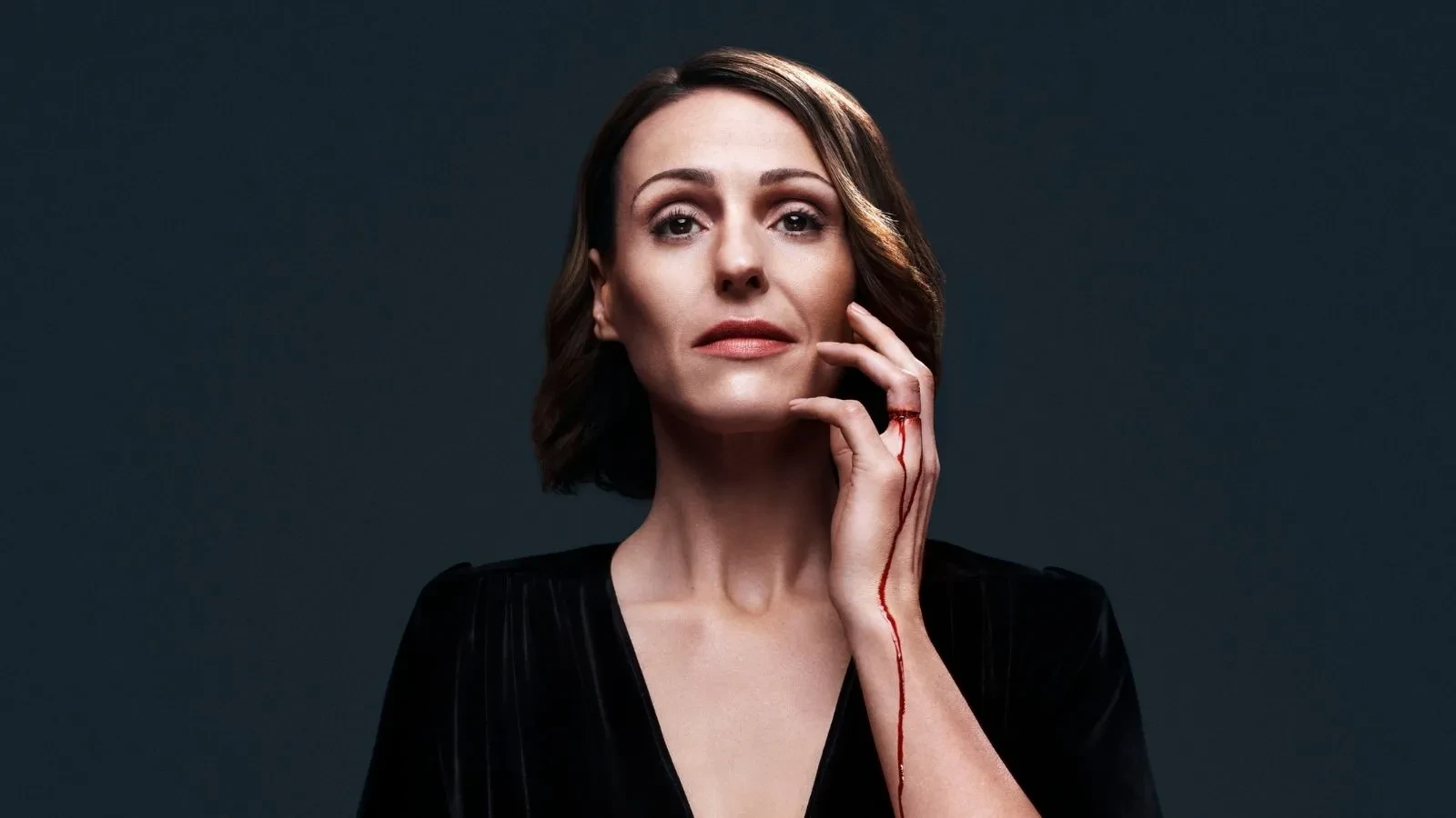 Key art for Doctor Foster season 3, Suranne Jones as Doctor Foster with blood dripping down her hand against a blue background.