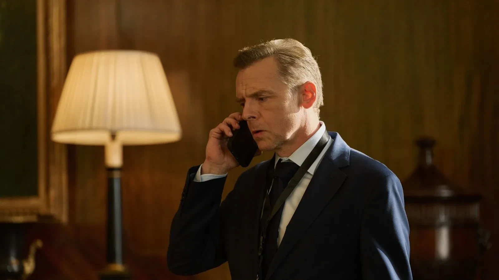 Government official takes an urgent phone call amid escalating cybersecurity and national security concerns in The Undeclared War.