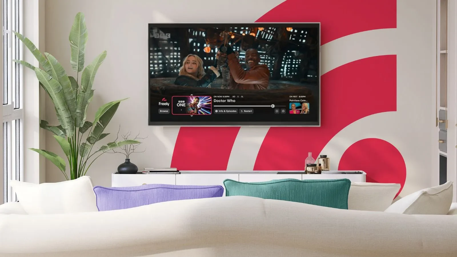A wall-mounted TV displaying Doctor Who on the Freely platform in a modern living room