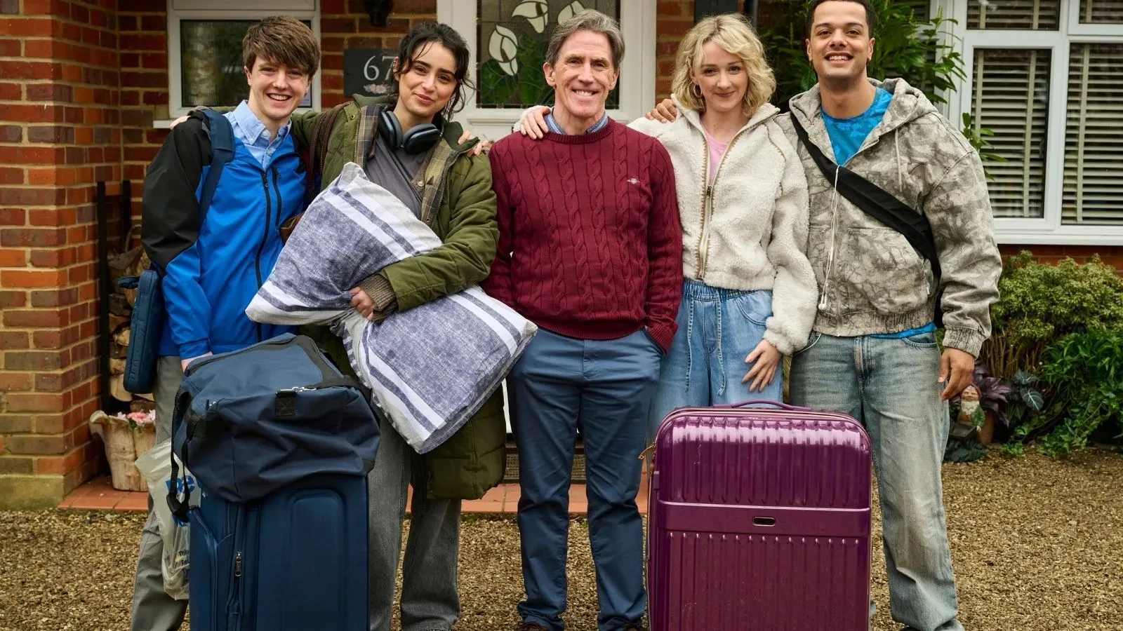 Students arrive at a shared house with suitcases and belongings in comedy-drama Bills Included.