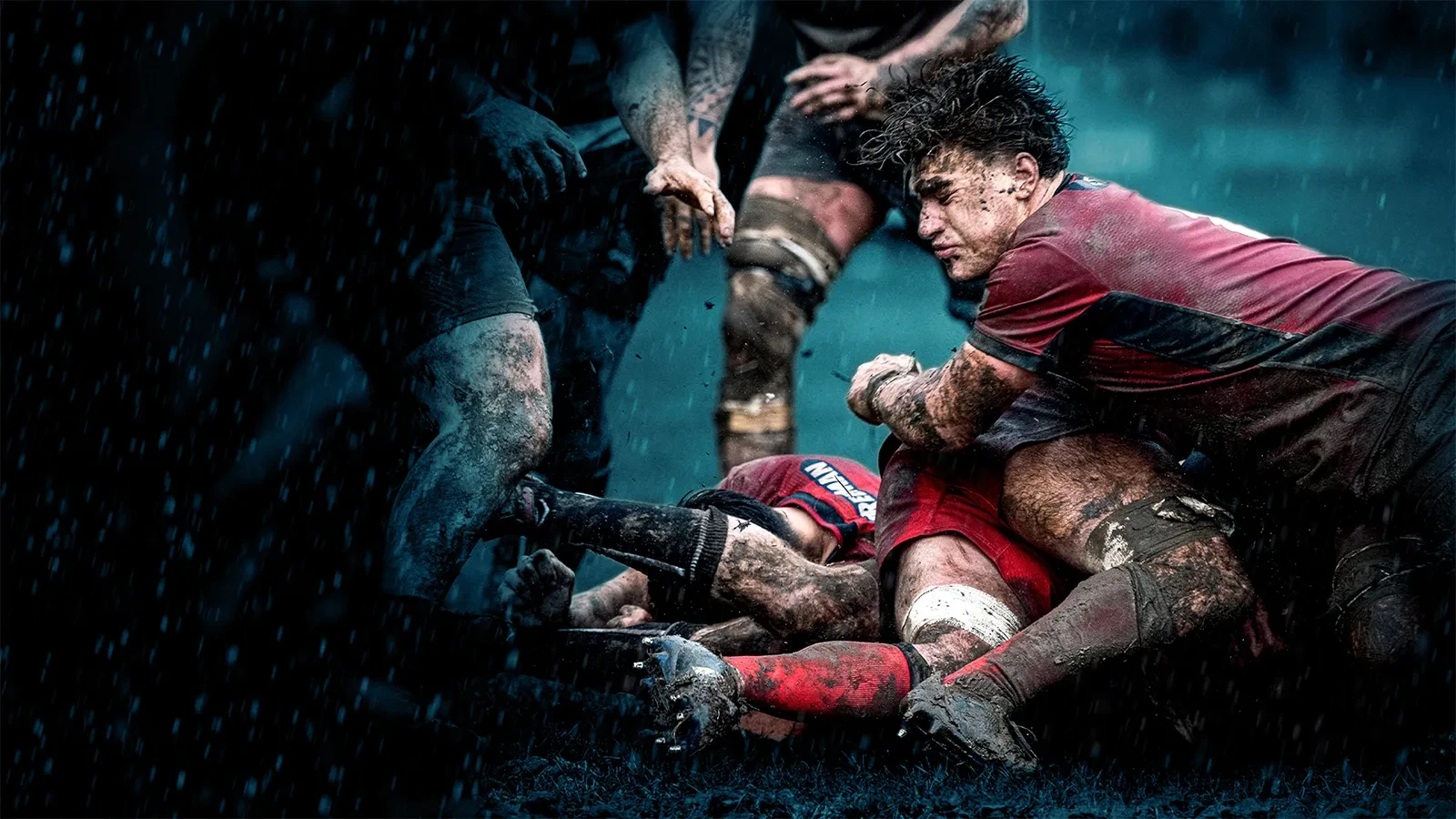 Promotional imagery for Champ Rugby. Rugby players tackling wearing purple kit.