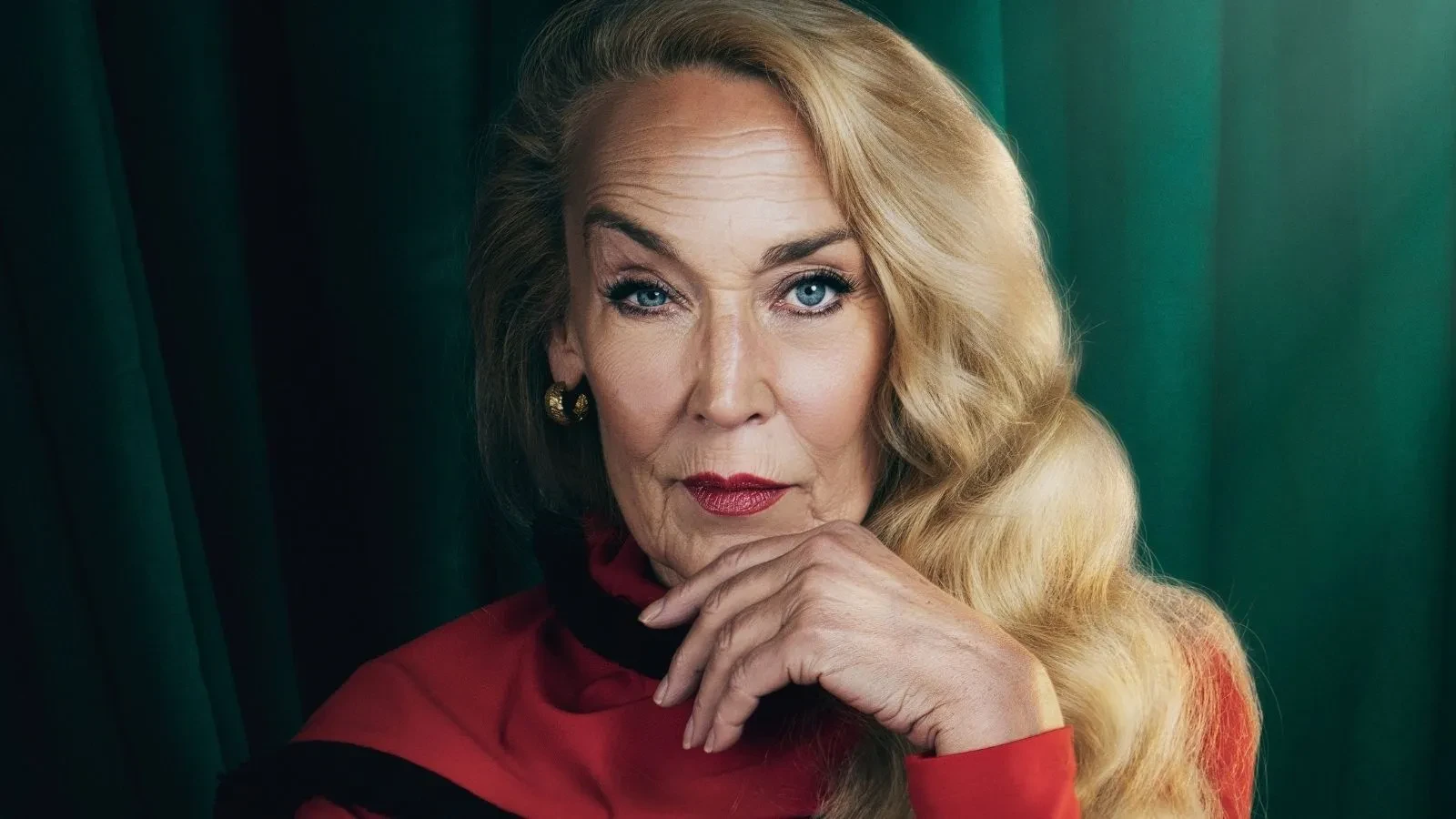 Jerry Hall stood against a green backdrop in Celebrity Traitors
