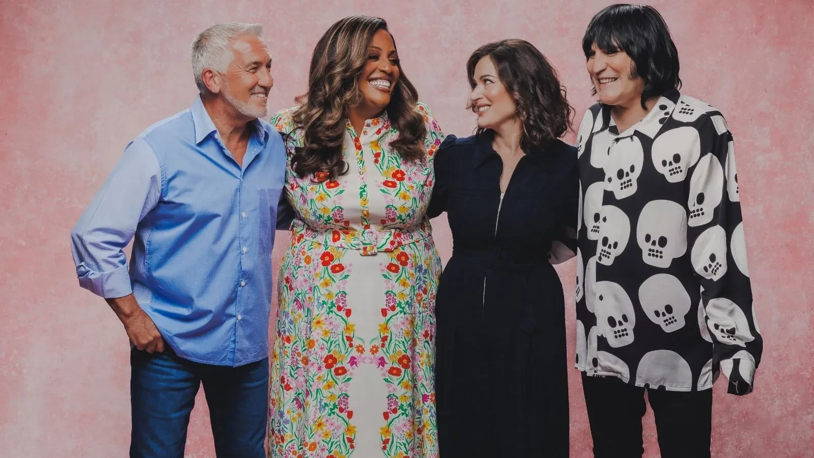 Paul Hollywood, Alison Hammond, Nigella Lawson and Noel Fielding standing against pink background in promotion of the Great British Bake Off