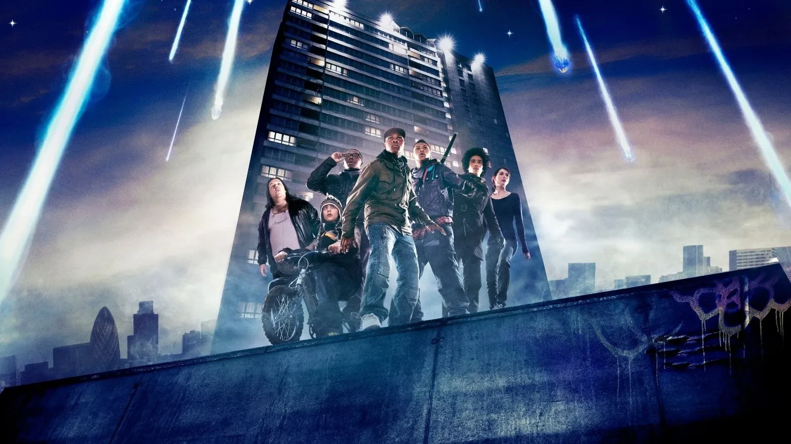 A group of kids stood by a council block in South London holding makeshift weapons in the film Attack the Block
