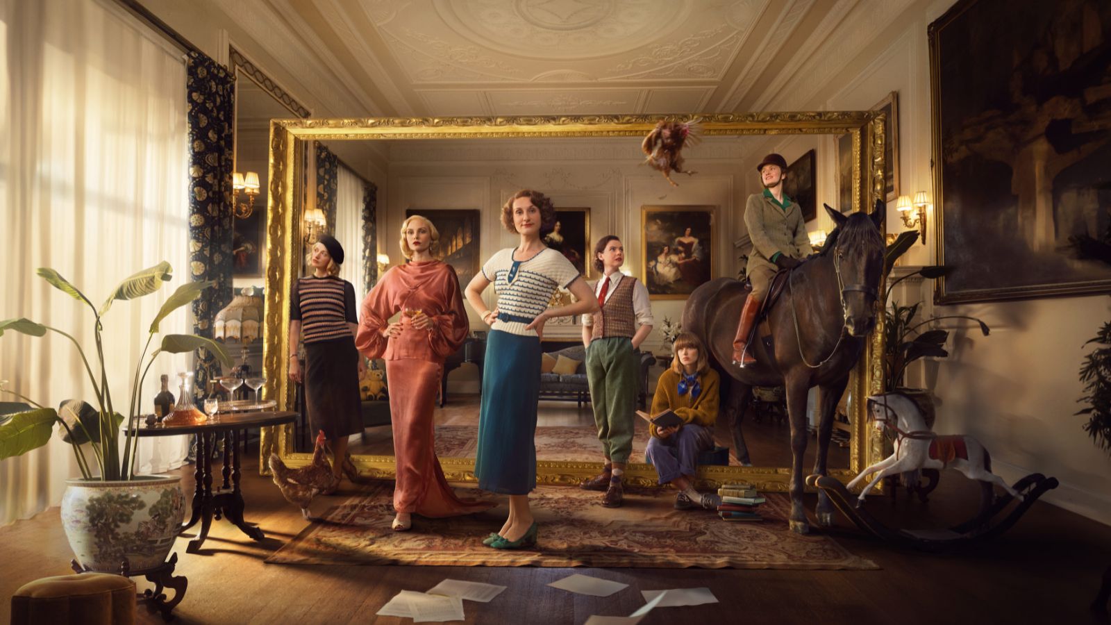 Women in 1930s clothing in a living room with one women on a horse