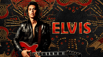 Person wearing a black leather jacket holding a red electric guitar in front of an ornate black and gold backdrop with the word ‘ELVIS’ in bold red lettering.