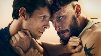 Close up of Richard Gadd and Jamie Bell with their arms against eachother in a violent manner in the BBC drama Half Man