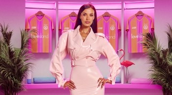Maya Jama in a pin Love Island room for season 13 of Love Island