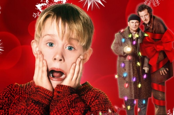 Festive red background with white snowflake patterns featuring a person in a red sweater in the foreground and two people wrapped in Christmas lights and a large red bow on the right side.