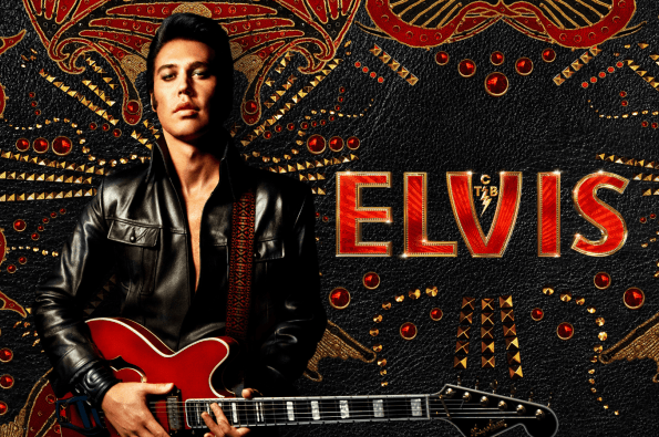 Person wearing a black leather jacket holding a red electric guitar in front of an ornate black and gold backdrop with the word ‘ELVIS’ in bold red lettering.