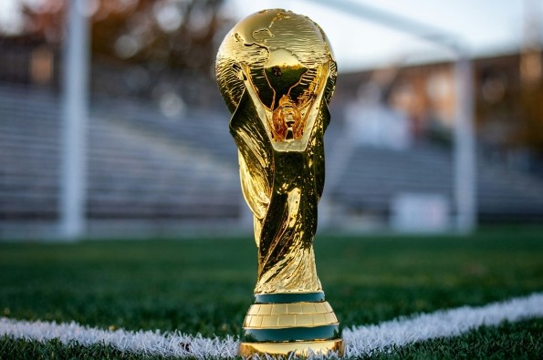 FIFA World Cup trophy on a football pitch