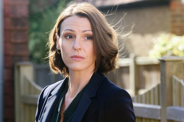 Promotional image from Doctor Foster showing a character standing outdoors in a residential street setting.