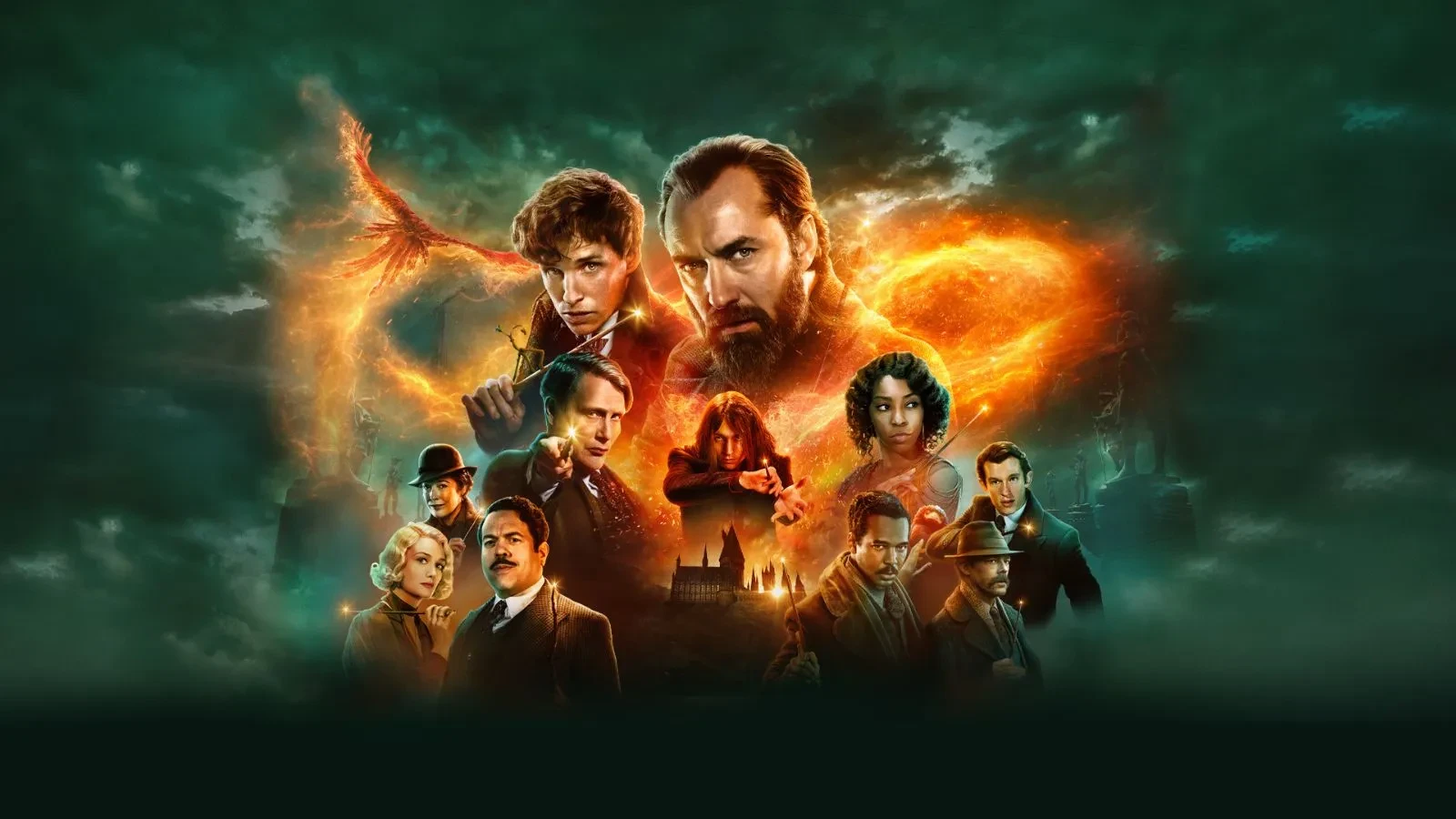 Promotional artwork for Fantastic Beasts: The Secrets of Dumbledore featuring a group of characters in period-style clothing arranged in front of a dramatic, fiery phoenix shape, with a dark green mystical background and Hogwarts castle faintly visible at the bottom.