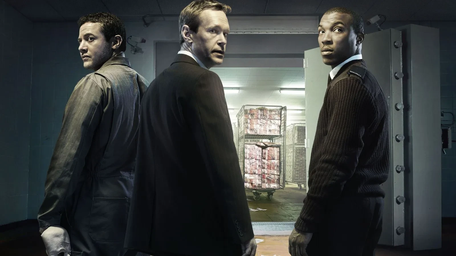 The men in suits with their back turned to the camera 