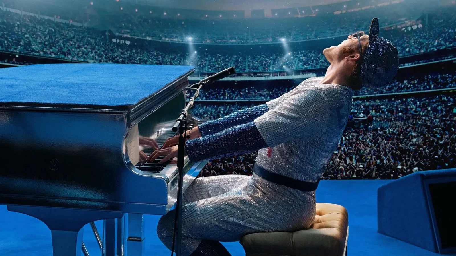 Man playing piano with passion, key art from Rocketman