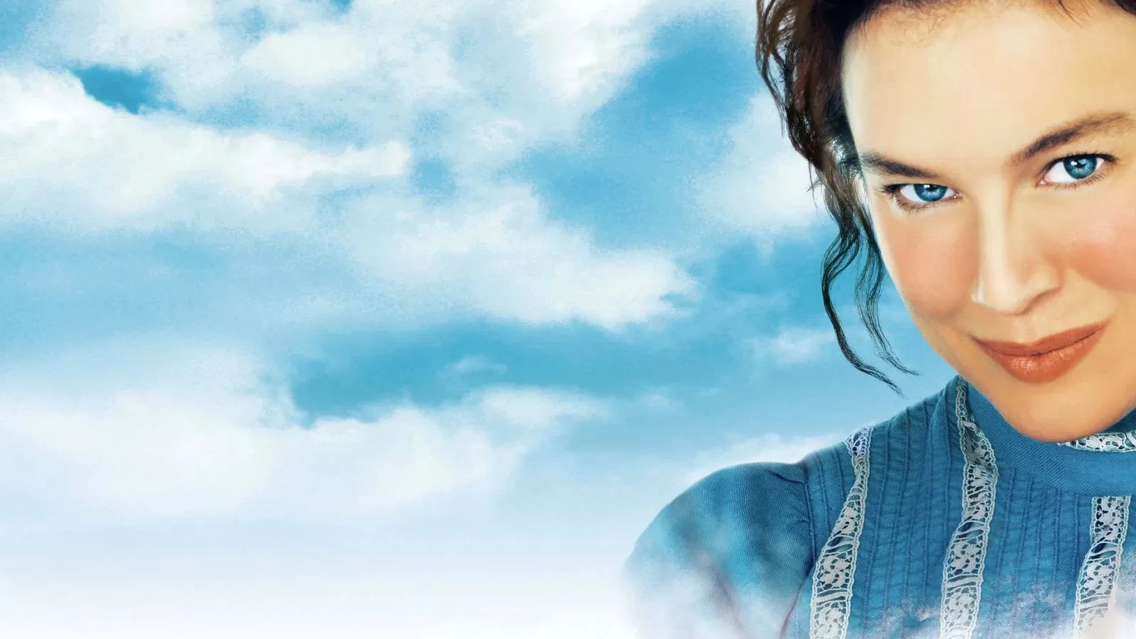 A close up of a women with brown hair and a blue top amongst a blue sky with clouds