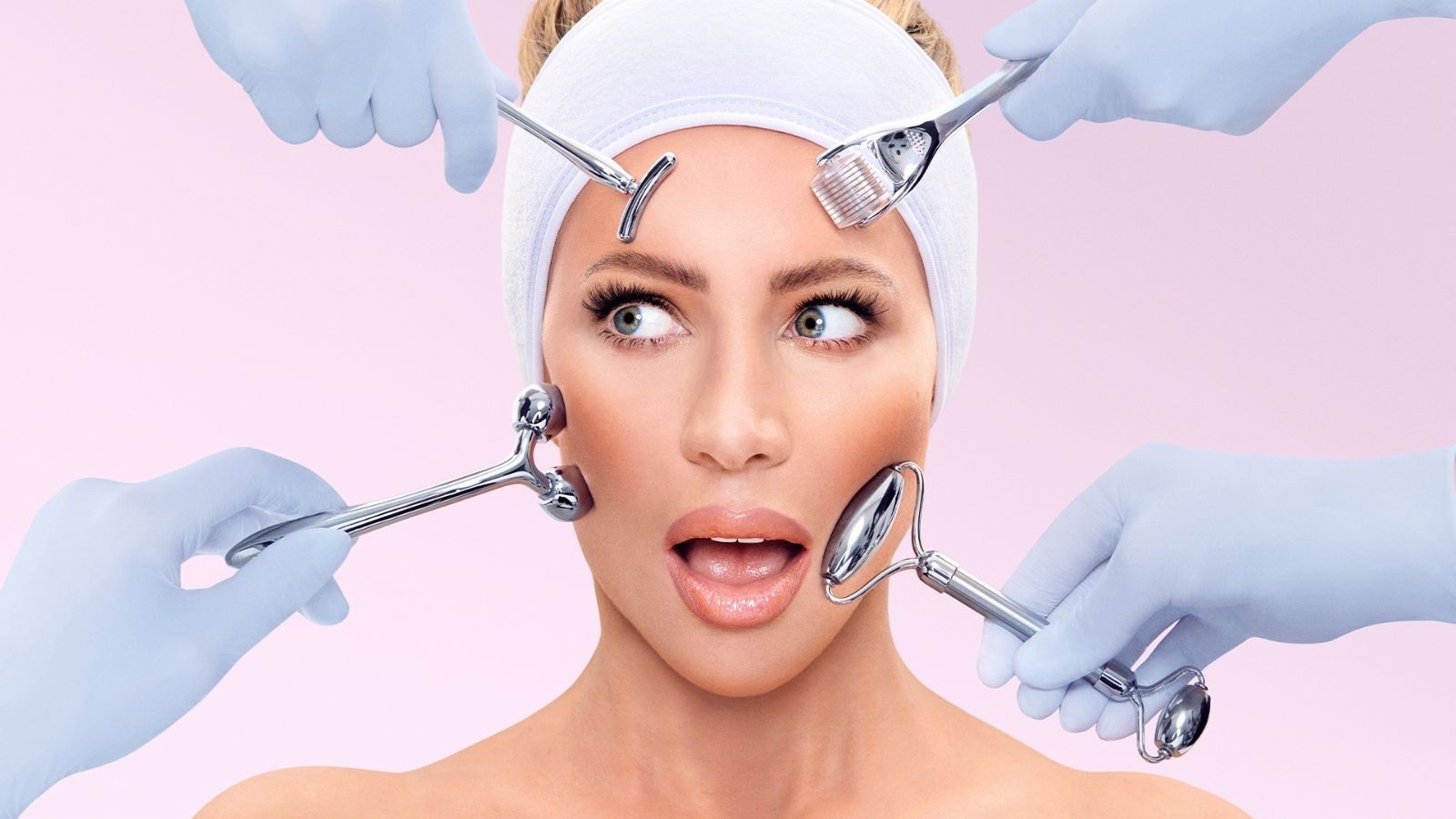 A women with her hair ina towel with face rollers being rolled against her face