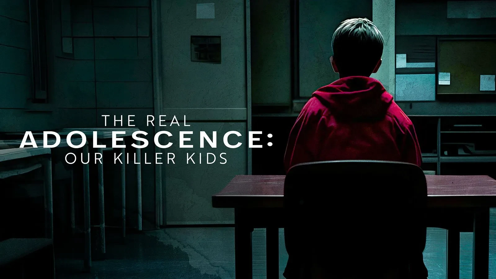 A boy in a red hoodie sat at a desk in a classroom. Text on top of the image reads The Real Adolescence: Our Killer Kids