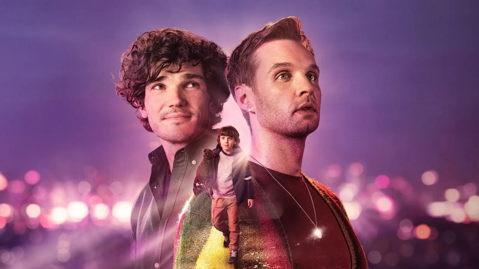 A close up of two men stood back to back with a little boy in a yellow jacket below them and a purple skyline with city lights behind them