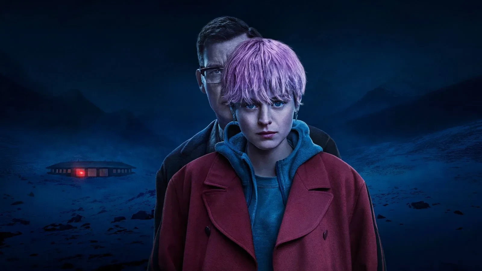 A women in a red coat with short pink hair and a man standing very closely behind her. A snowy a scene in the background with a mysterious red light emitting from a building