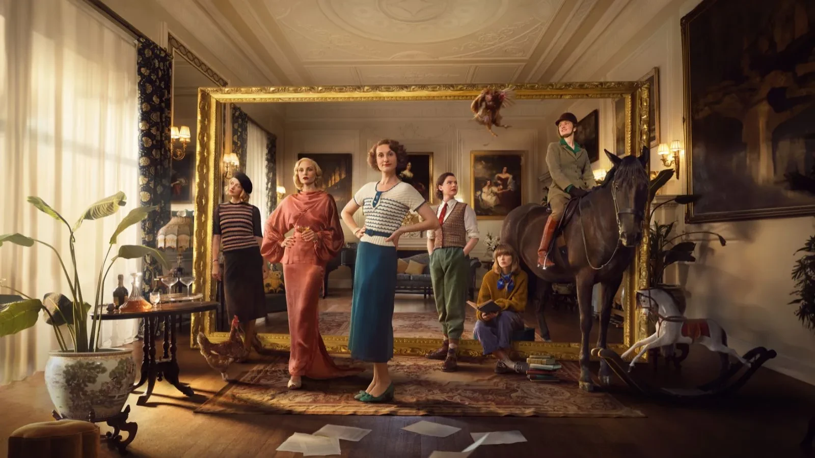 Women in 1930s clothing in a living room with one women on a horse