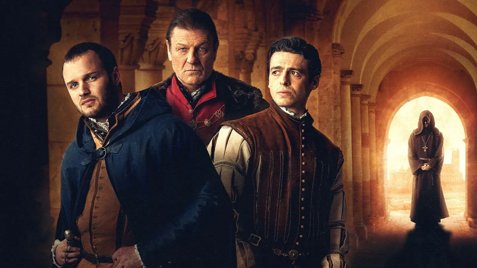 One older man and two younger men stood in a corridor with a hooded figure behind them in medieval clothing