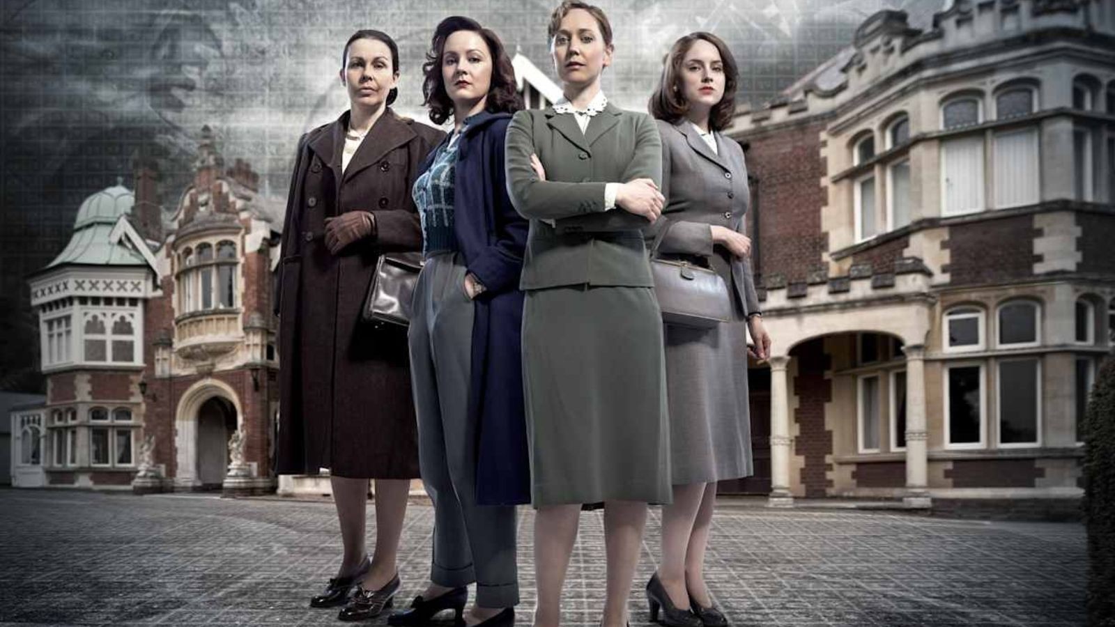 Four women in 1950s clothing stood in front of an old building