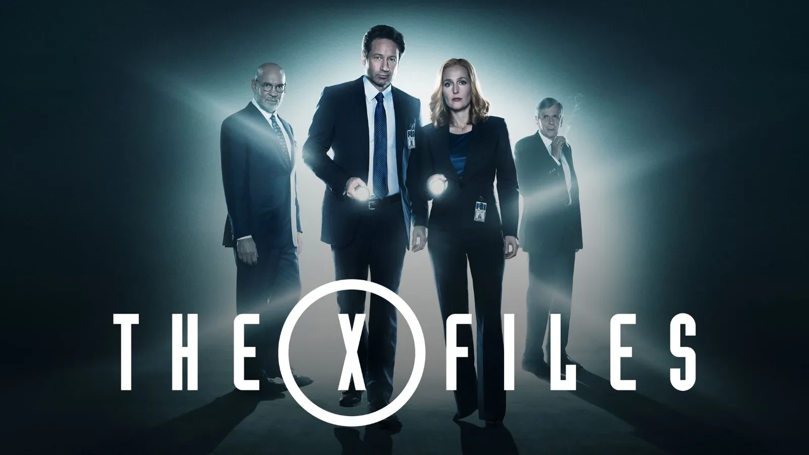 The X Files copy with three men and one women in suits holding torches