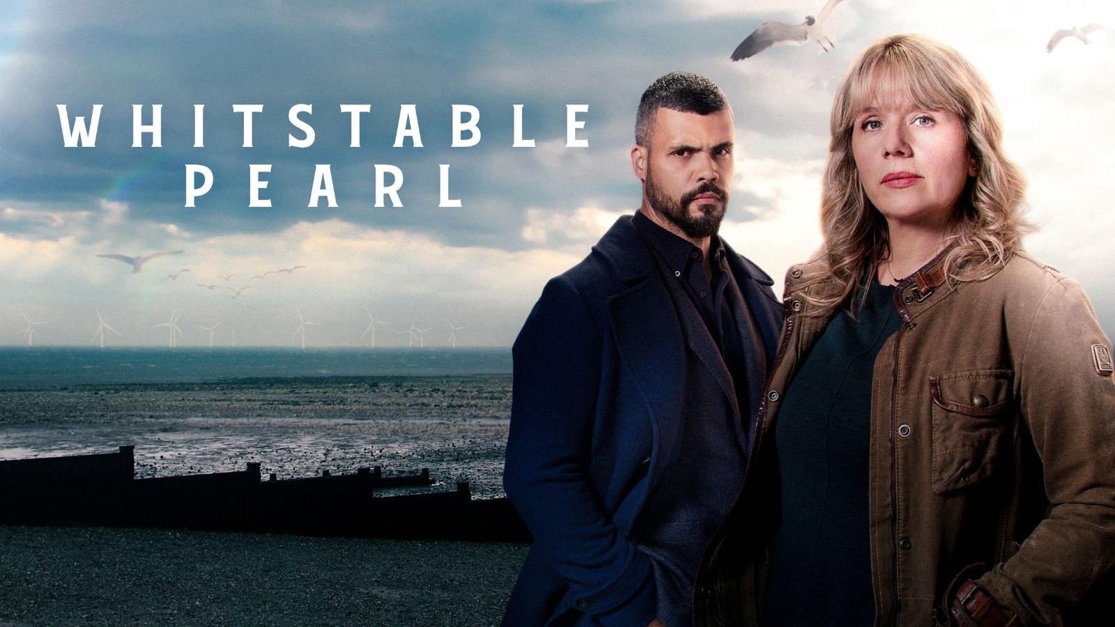 Whitstable Pearl key art with a man and women stood on a beach